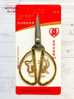 Фото ножиці золота фігурна ручка
