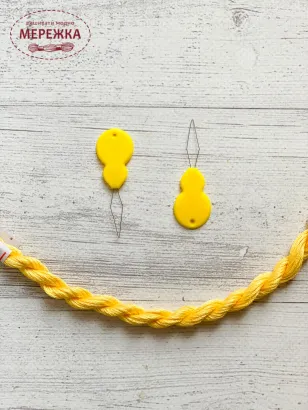 Фото нитковдівач пластиковий 